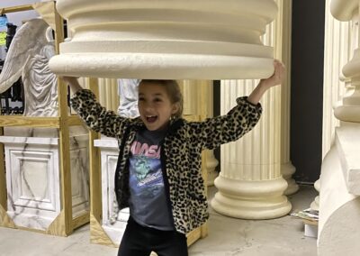 A child plays with stage props at Castleton